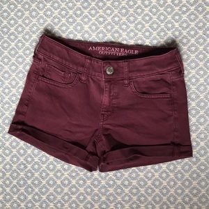 Maroon jean shorts.